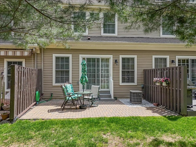 back of house featuring central air condition unit and a patio
