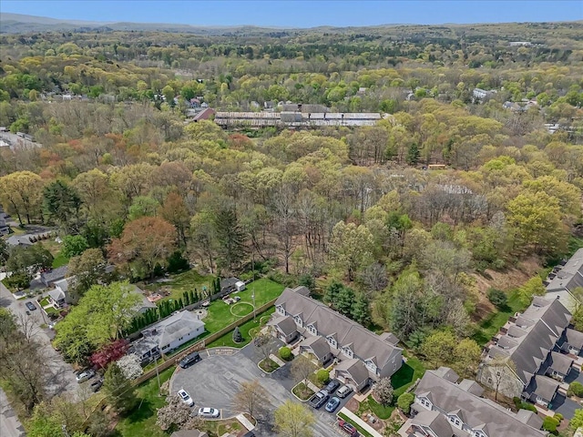 drone / aerial view with a view of trees