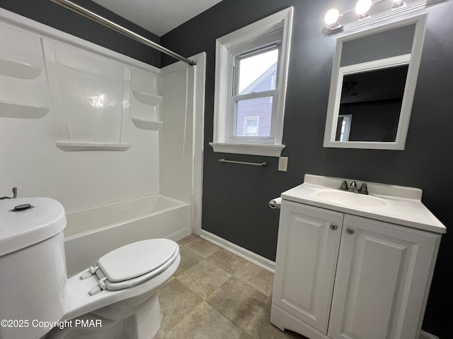 bathroom with  shower combination, vanity, toilet, and baseboards