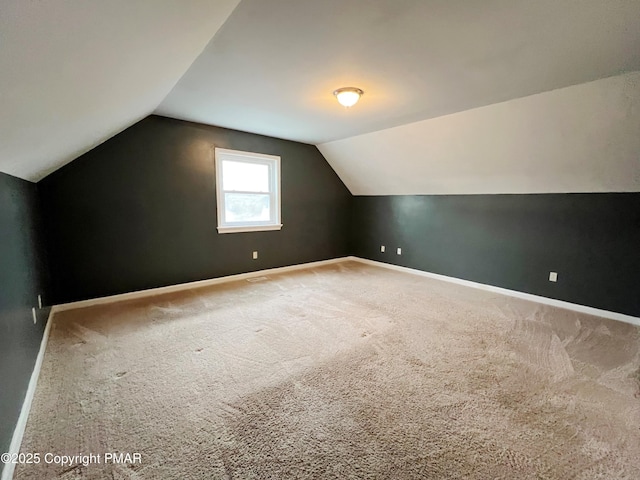 bonus room with lofted ceiling, carpet, and baseboards