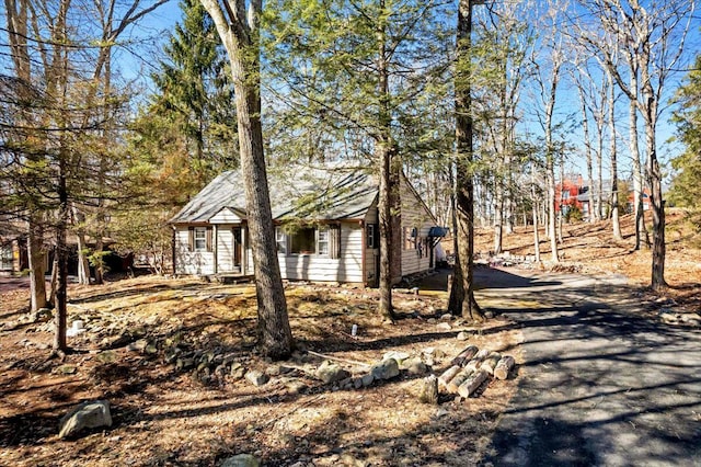 view of home's exterior with aphalt driveway