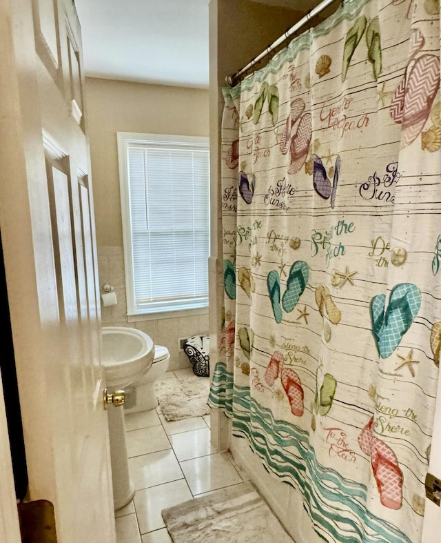 bathroom with tile patterned floors and toilet