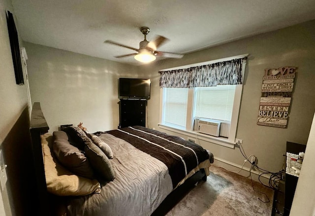 carpeted bedroom with cooling unit, baseboards, and ceiling fan