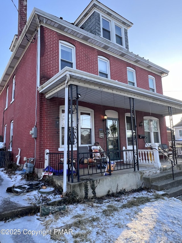 view of property featuring a porch