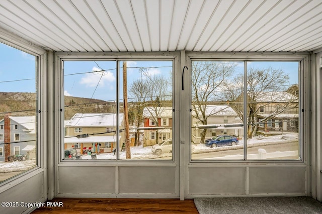 unfurnished sunroom featuring a residential view