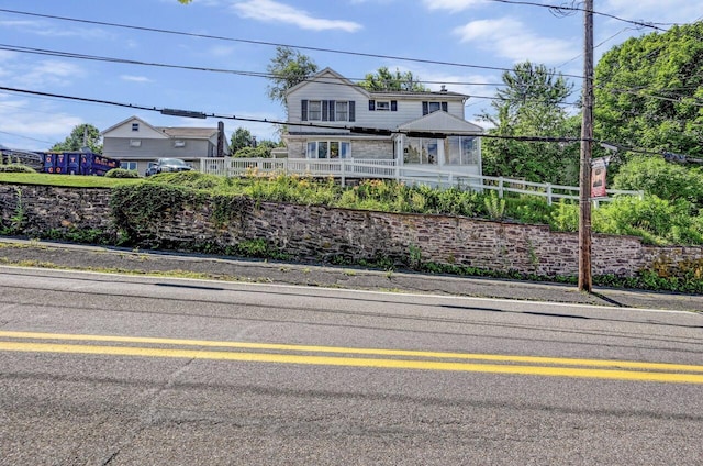 view of front of property featuring fence