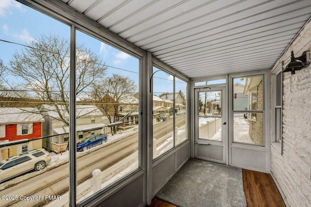 unfurnished sunroom featuring a residential view