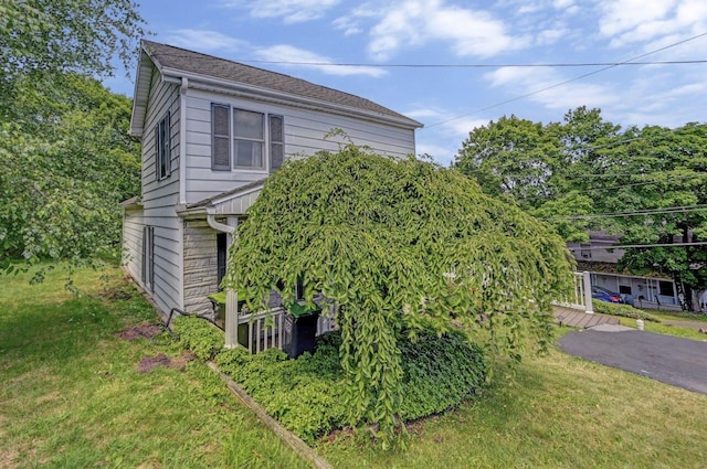 view of home's exterior featuring a yard