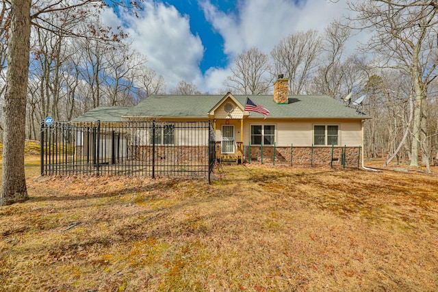 ranch-style home featuring stone siding, a chimney, roof with shingles, and fence