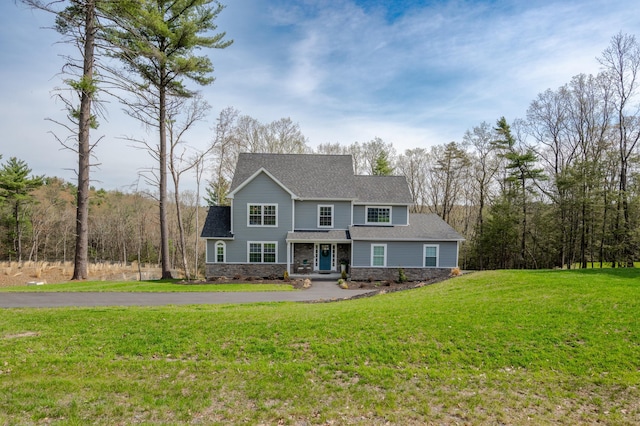131 Chinaberry Way, Kunkletown, PA 18058 - view of front of house with stone siding, a front yard, and roof with shingles