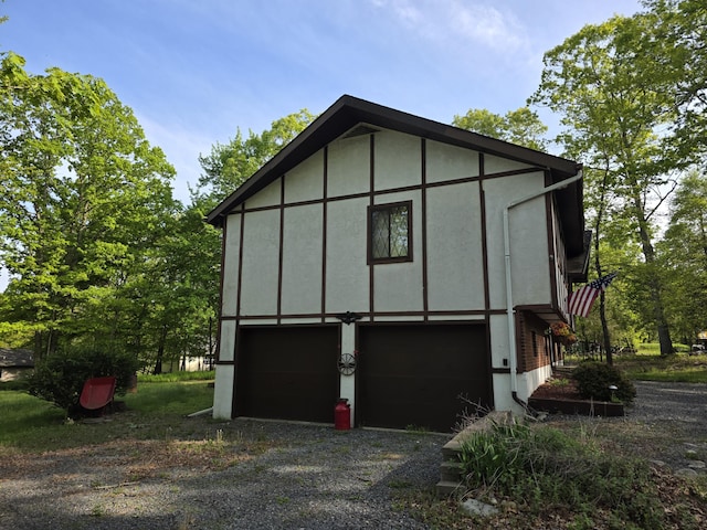 234 Saturn Dr, Bushkill, PA 18324 - view of side of property with a garage and driveway
