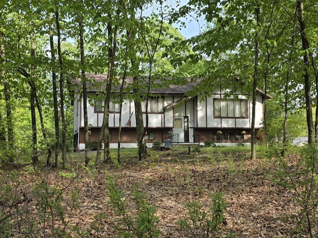 234 Saturn Dr, Bushkill, PA 18324 - rear view of house featuring brick siding