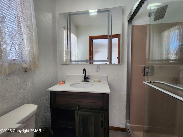 234 Saturn Dr, Bushkill, PA 18324 - full bath with a textured wall, vanity, a shower stall, and toilet