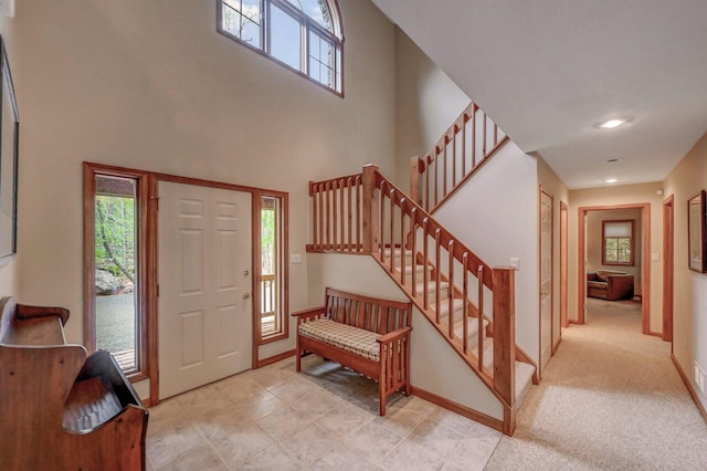 3110 Tall Timber Lake Rd, Pocono Pines, PA 18350 - foyer entrance featuring stairway, a high ceiling, baseboards, and recessed lighting