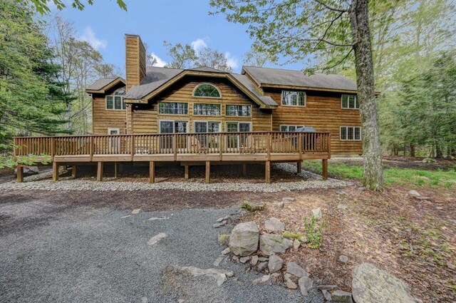 3110 Tall Timber Lake Rd, Pocono Pines, PA 18350 - back of property featuring a chimney and a wooden deck