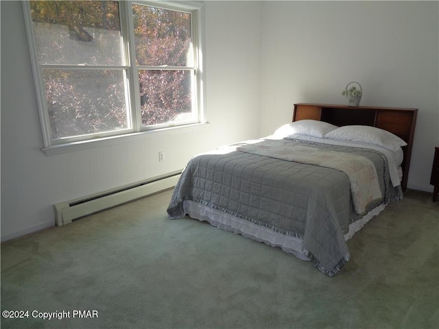 bedroom with carpet and a baseboard radiator