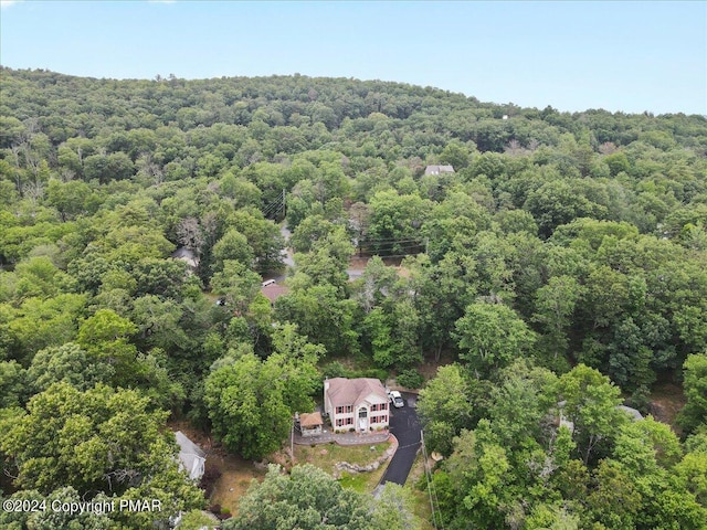 aerial view featuring a view of trees