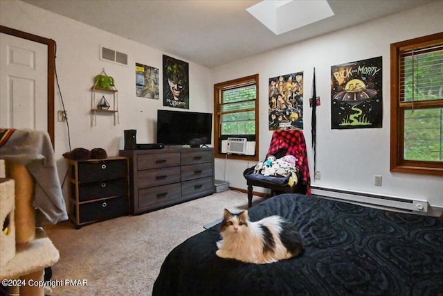 carpeted bedroom featuring a skylight, visible vents, cooling unit, and baseboard heating