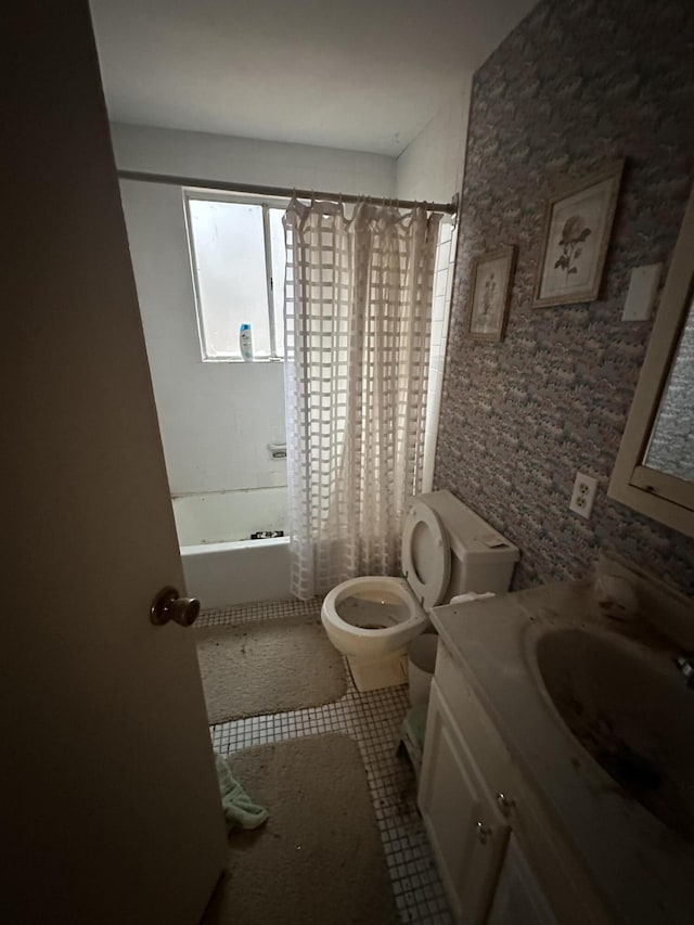 bathroom with shower / bath combo with shower curtain, vanity, toilet, and tile patterned floors