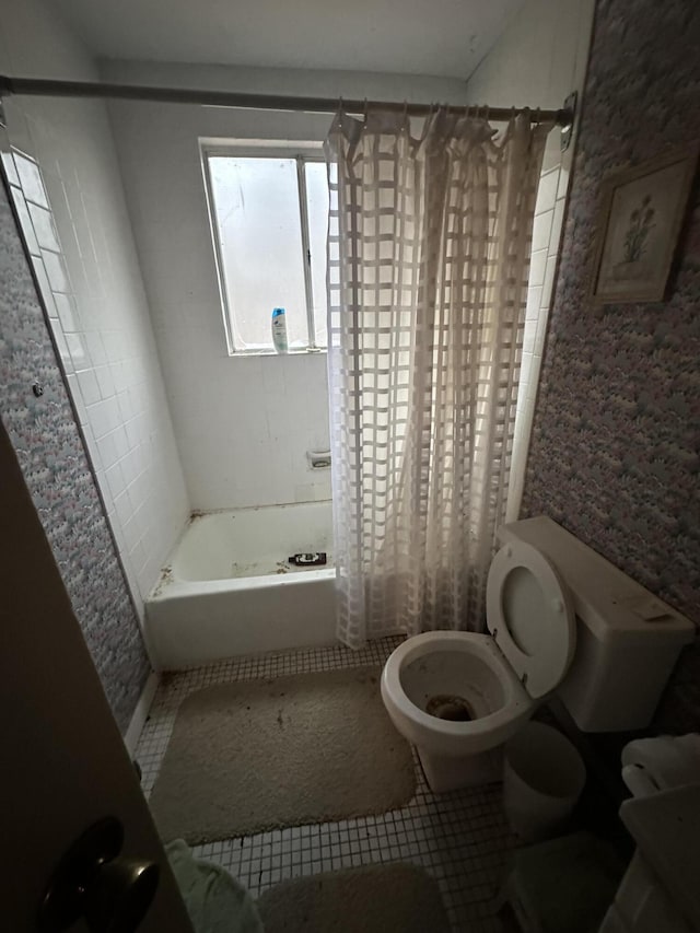 bathroom featuring shower / tub combo, toilet, and tile patterned floors