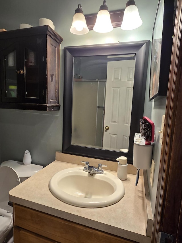 bathroom with toilet and vanity