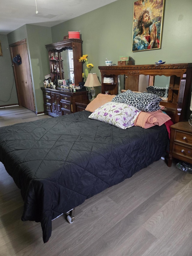 bedroom with wood finished floors