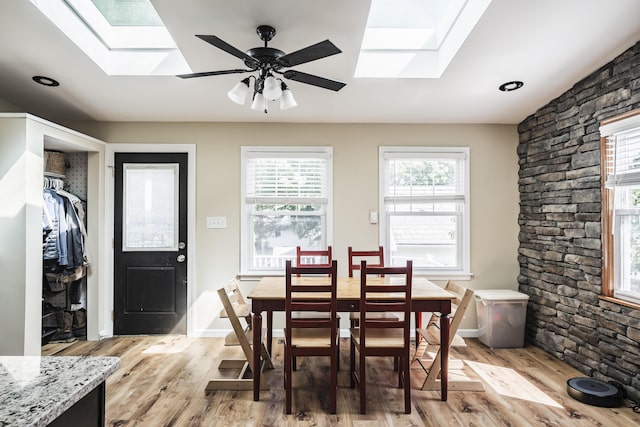 631 Main St, Tatamy, PA 18085 - dining room with a skylight, light wood-type flooring, and ceiling fan