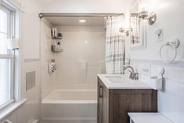631 Main St, Tatamy, PA 18085 - full bathroom with tile walls, vanity, and shower / tub combo