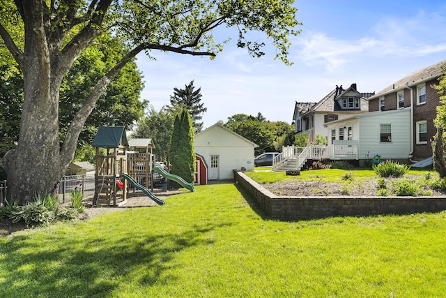631 Main St, Tatamy, PA 18085 - view of grassy yard featuring a playground and a deck