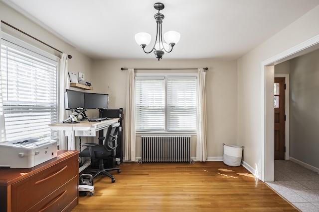 631 Main St, Tatamy, PA 18085 - office area featuring radiator, light wood finished floors, baseboards, and a chandelier