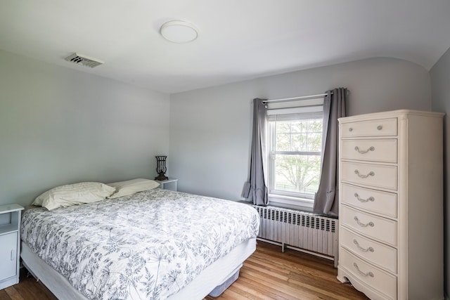 631 Main St, Tatamy, PA 18085 - bedroom with radiator heating unit and wood finished floors