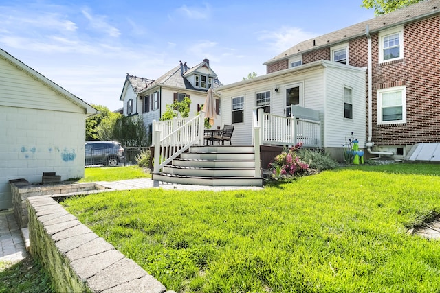 631 Main St, Tatamy, PA 18085 - rear view of house featuring a wooden deck and a yard