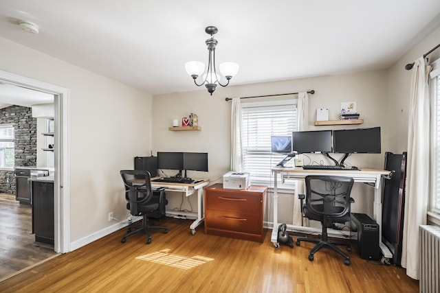 631 Main St, Tatamy, PA 18085 - office area featuring radiator heating unit, healthy amount of natural light, and wood finished floors