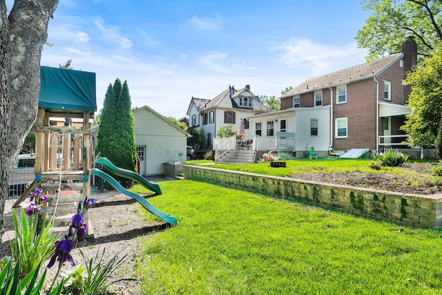 631 Main St, Tatamy, PA 18085 - view of green lawn with a playground and a wooden deck