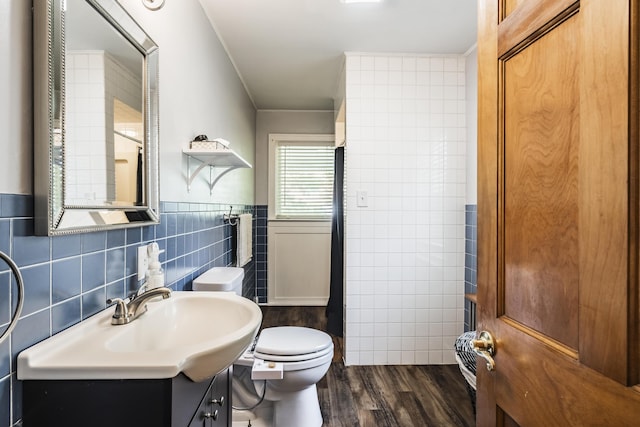 631 Main St, Tatamy, PA 18085 - full bath with tile walls, toilet, wood finished floors, and vanity