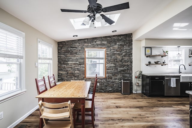 631 Main St, Tatamy, PA 18085 - dining space with a skylight, a ceiling fan, wood finished floors, and vaulted ceiling