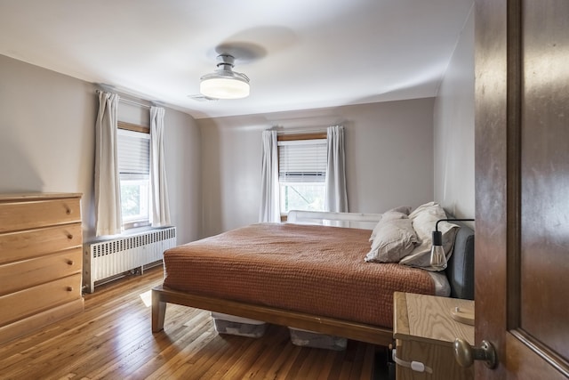 631 Main St, Tatamy, PA 18085 - bedroom featuring radiator heating unit and wood-type flooring