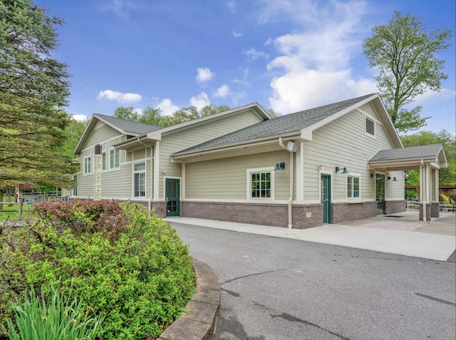 383 Main St, Gouldsboro, PA 18424 - view of side of home with stone siding and a shingled roof