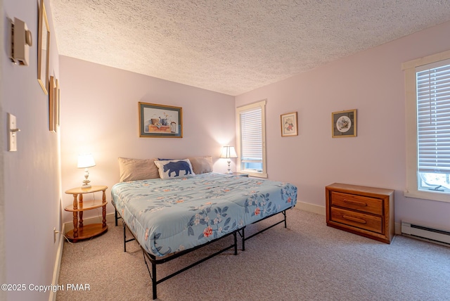 carpeted bedroom featuring a baseboard radiator, baseboards, and a textured ceiling