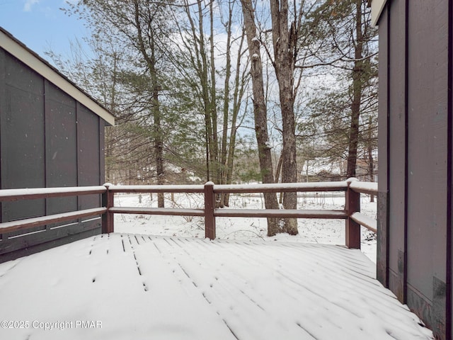 view of snow covered deck