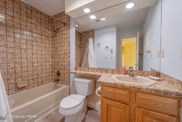 bathroom with shower / tub combo, vanity, toilet, and recessed lighting