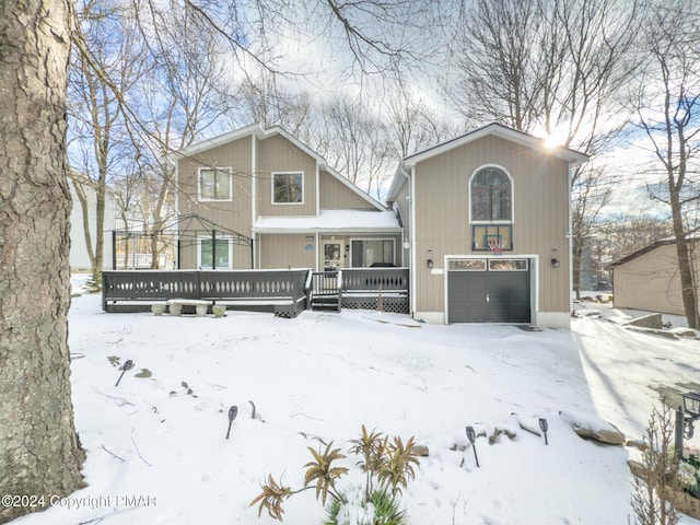 chalet / cabin featuring a garage and a porch