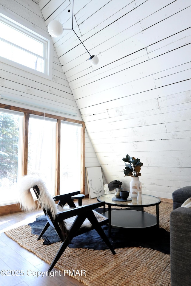 sunroom featuring lofted ceiling