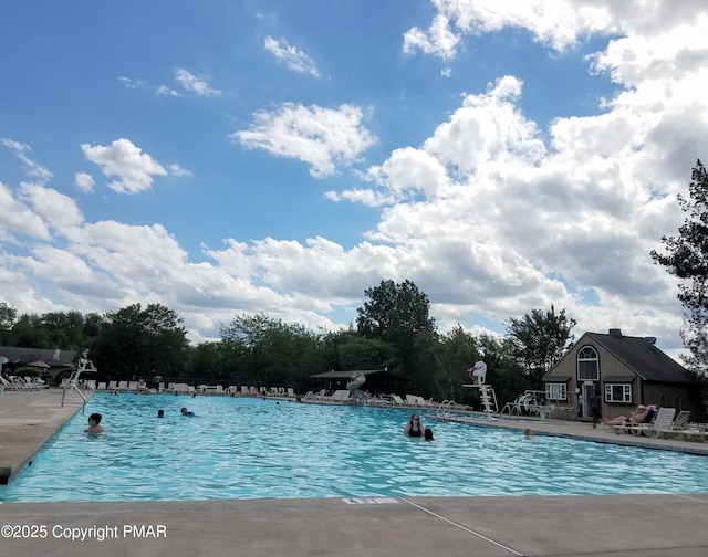 view of swimming pool featuring a patio area