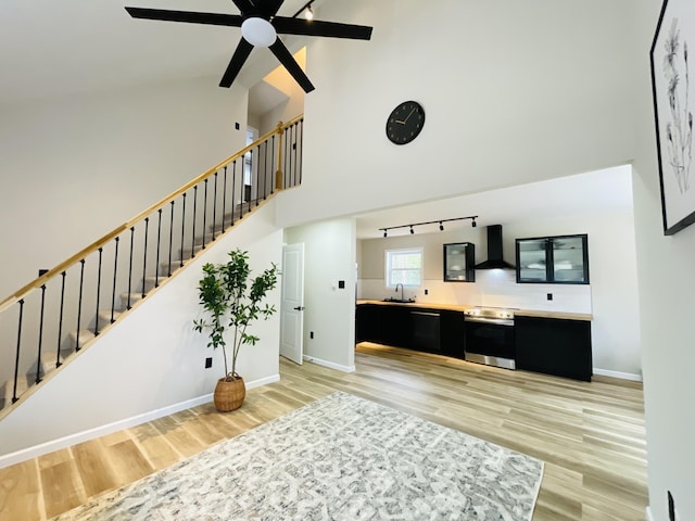 1216 Winding Way, Tobyhanna, PA 18466 - stairway with wood finished floors, high vaulted ceiling, a ceiling fan, rail lighting, and beam ceiling
