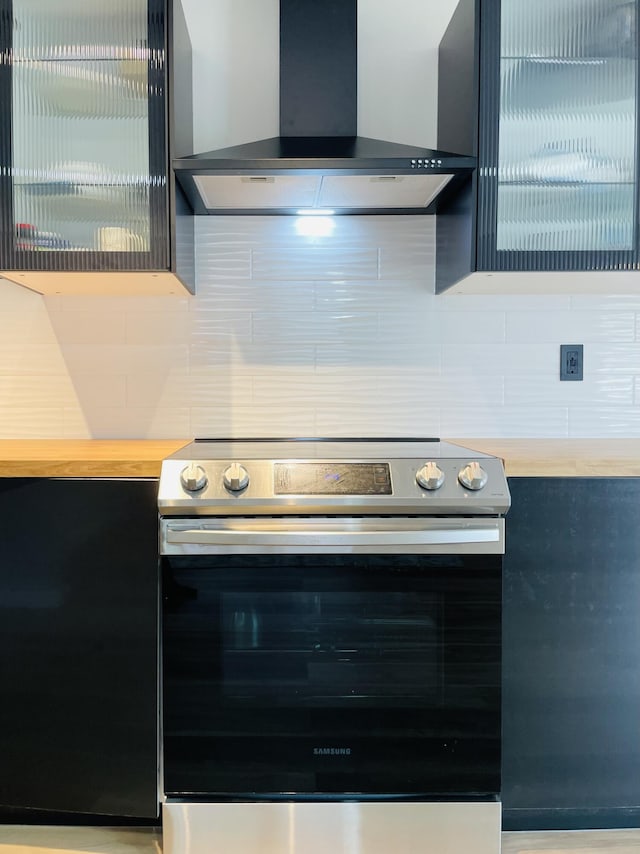 1216 Winding Way, Tobyhanna, PA 18466 - kitchen with wall chimney exhaust hood, electric range, and decorative backsplash