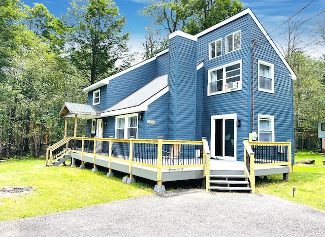1216 Winding Way, Tobyhanna, PA 18466 - view of front of house featuring a deck, a front lawn, and cooling unit
