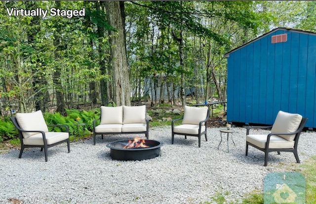 1216 Winding Way, Tobyhanna, PA 18466 - view of patio / terrace featuring a fire pit and a storage unit