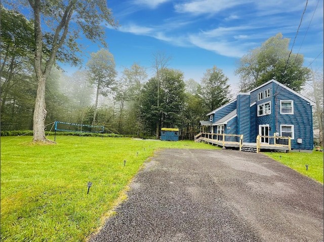 1216 Winding Way, Tobyhanna, PA 18466 - view of home's exterior featuring a yard, a deck, and asphalt driveway