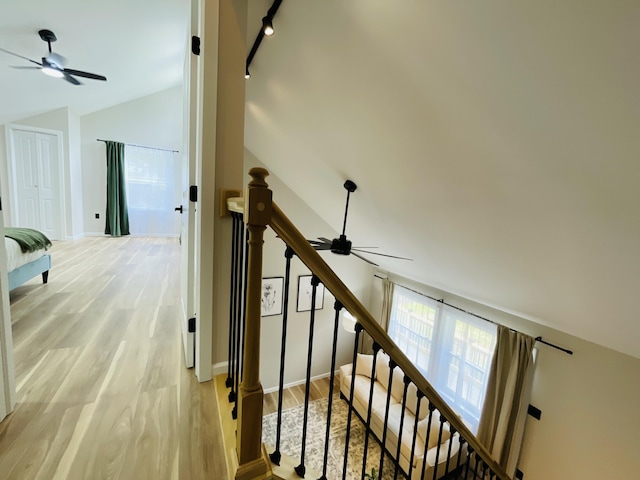 1216 Winding Way, Tobyhanna, PA 18466 - staircase featuring a ceiling fan, lofted ceiling, wood finished floors, and rail lighting